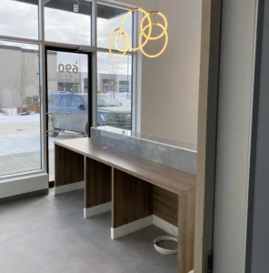 Timber window counter and stools in a retail storefront